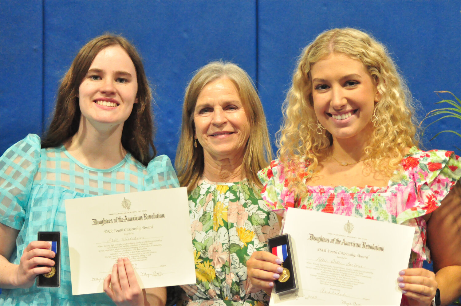 The DAR Youth Citizenship Medal is for a boy or girl in grades 5 through 11. The medal is awarded to students who fulfill the qualities of honor, service, courage, leadership, and patriotism. Debbie Cannon, Annandale Chapter DAR Good Citizen Chairman, presented  to 10th grader Katie Grace Barbour and 11th grader Lola Williams  at the MCHS Awards Day. Pictured are Lola Williams, Debbie Cannon, and Katie Grace Barbour.